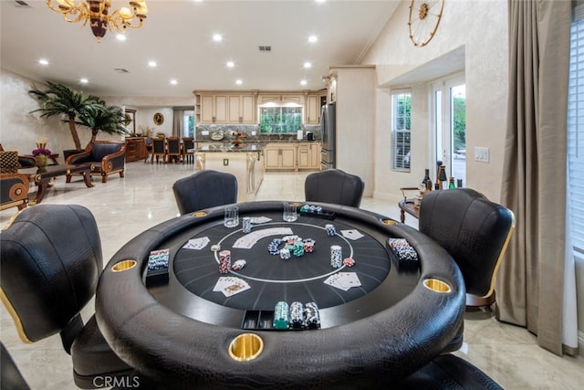 dining space with an inviting chandelier and ornamental molding