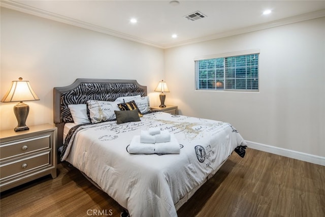 bedroom featuring dark hardwood / wood-style floors and crown molding