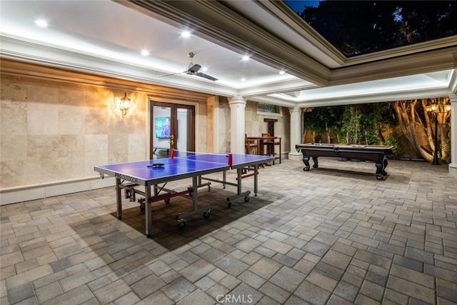 game room with a tray ceiling, decorative columns, billiards, and crown molding