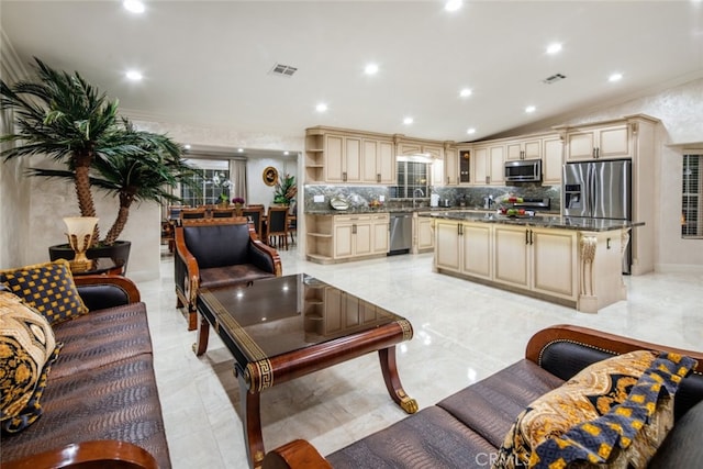 living room with sink and ornamental molding