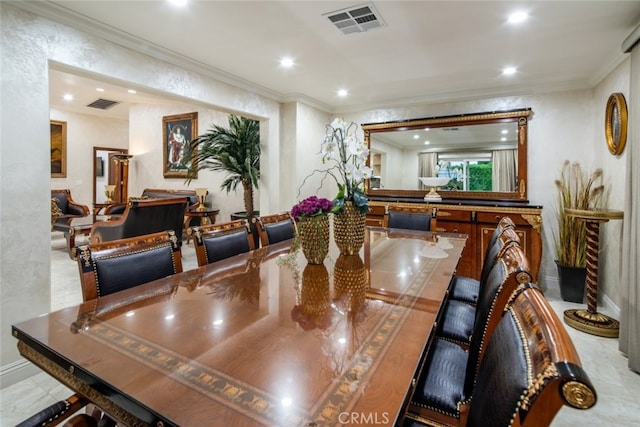 dining space featuring ornamental molding