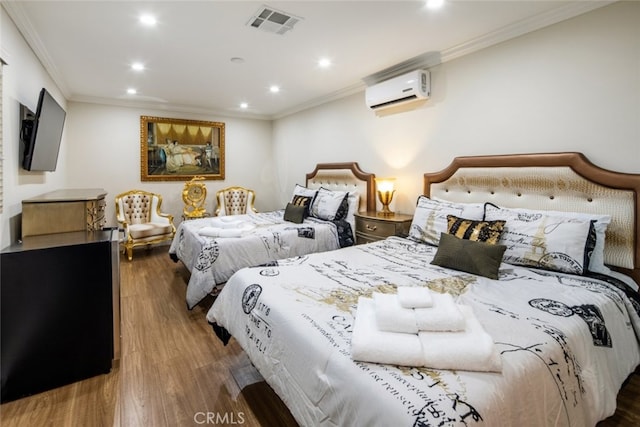 bedroom featuring crown molding, dark hardwood / wood-style floors, and a wall mounted air conditioner