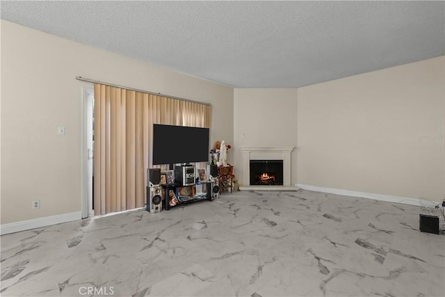 unfurnished living room with a textured ceiling