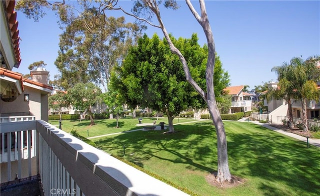 view of community featuring a residential view and a lawn