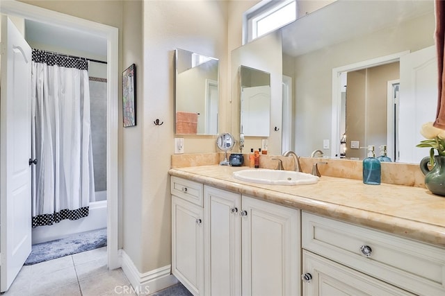 bathroom featuring shower / tub combo with curtain, tile patterned floors, and vanity