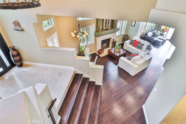 living room featuring hardwood / wood-style flooring and a notable chandelier