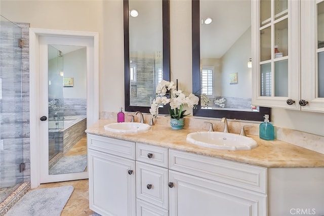 bathroom featuring shower with separate bathtub, tile patterned floors, and vanity