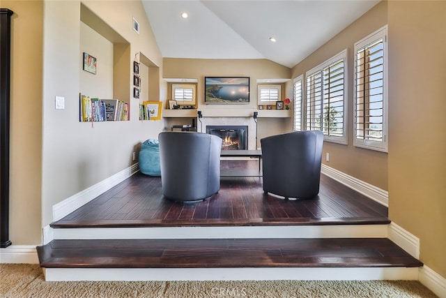 living room featuring lofted ceiling