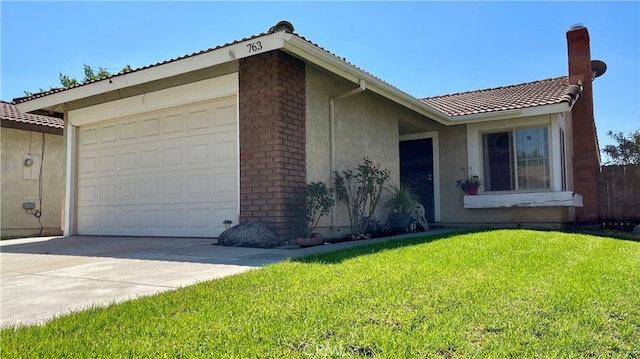 view of front facade with a garage and a front lawn