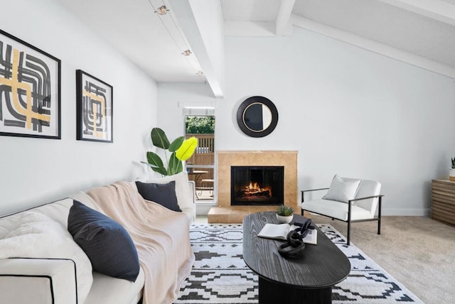 living room with carpet, a high end fireplace, and lofted ceiling with beams