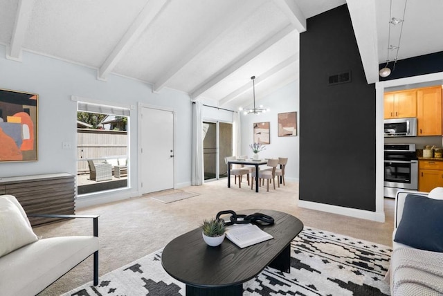 carpeted living room with lofted ceiling with beams and a chandelier