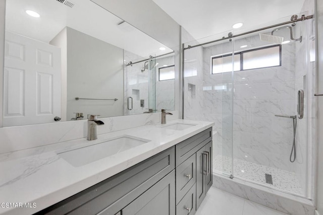 bathroom featuring vanity and an enclosed shower