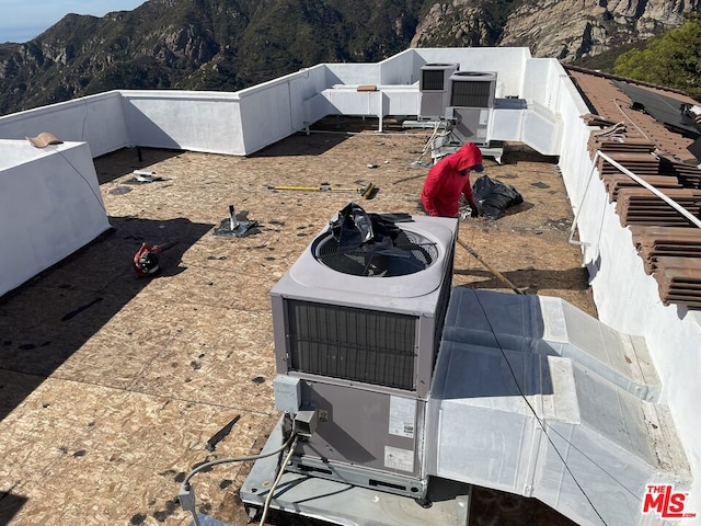 exterior details featuring a mountain view and central AC