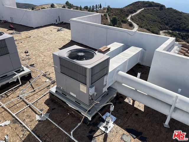 exterior details featuring a mountain view and cooling unit