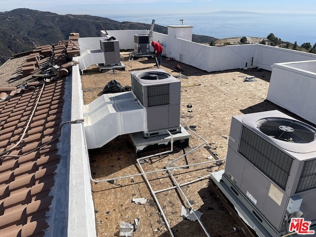 view of yard with a mountain view and central air condition unit