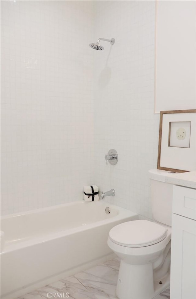 full bathroom featuring vanity, toilet, and tiled shower / bath