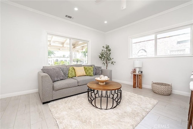 living room with light hardwood / wood-style flooring and ornamental molding