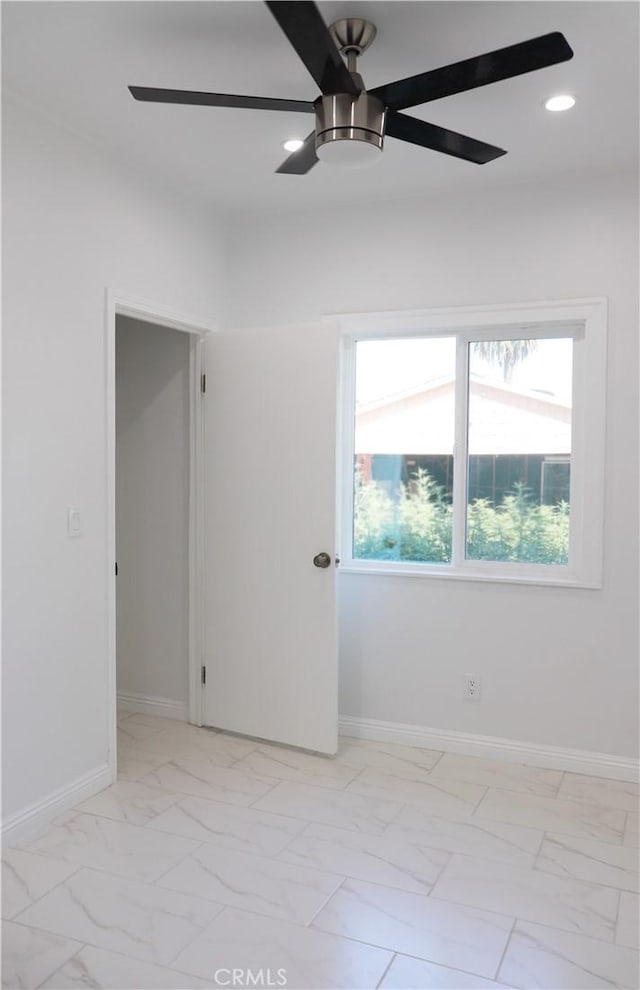 spare room featuring ceiling fan