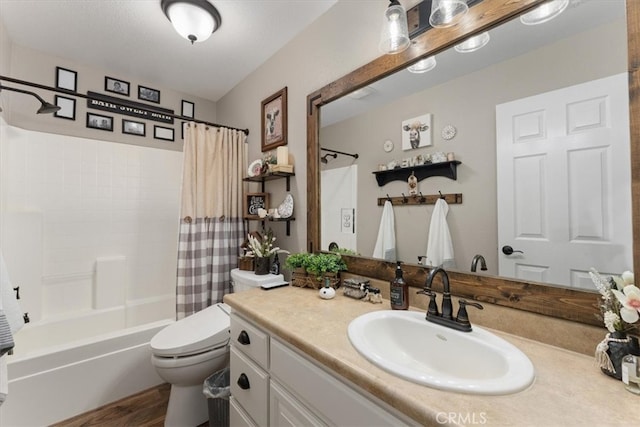 full bathroom featuring shower / bath combo with shower curtain, wood-type flooring, vanity, and toilet