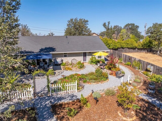 back of property with a patio