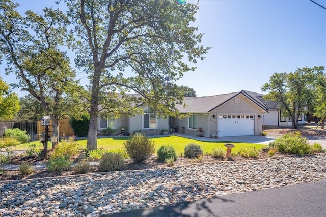 ranch-style home featuring a front yard and a garage