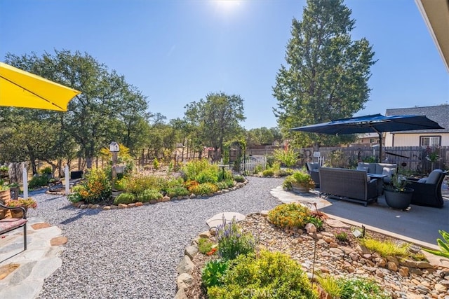 view of yard with an outdoor living space and a patio area