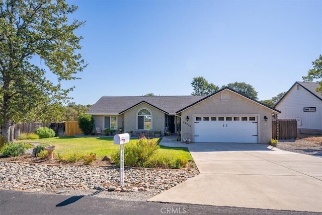 ranch-style house with a garage and a front lawn