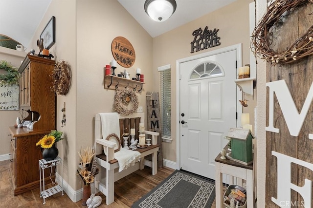 foyer entrance featuring hardwood / wood-style flooring and vaulted ceiling