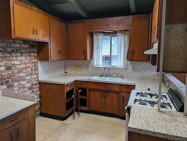 kitchen with sink and white range with gas stovetop