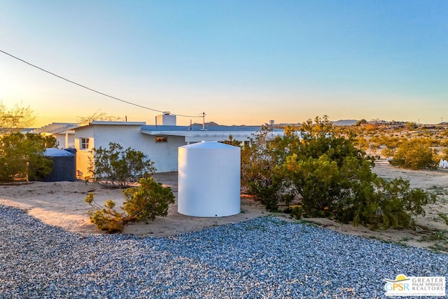 view of property exterior at dusk