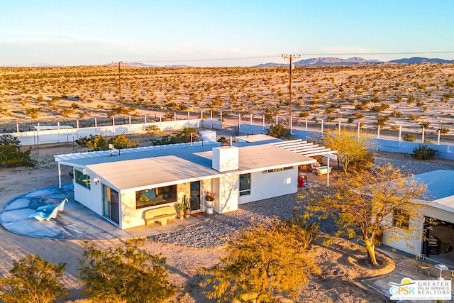 birds eye view of property with a mountain view