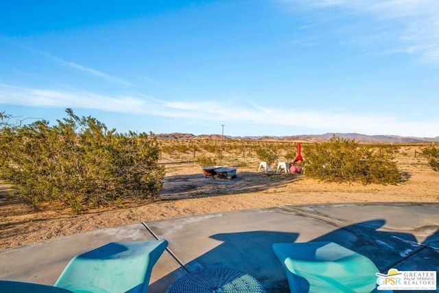 exterior space featuring a patio area and a mountain view