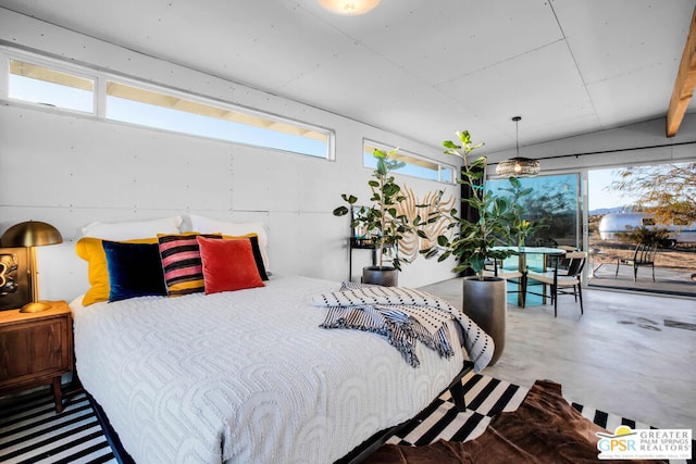 bedroom featuring concrete floors