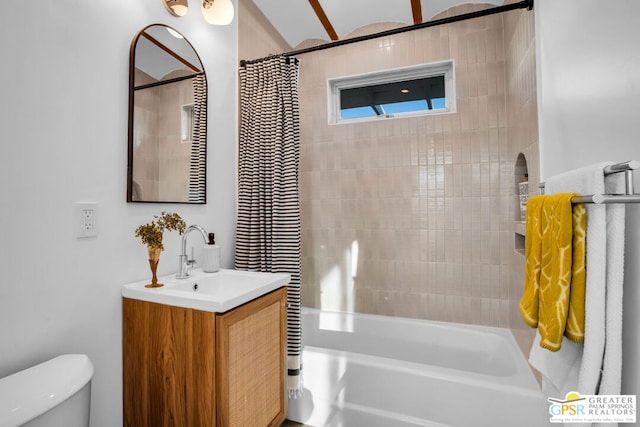 full bathroom featuring toilet, shower / bath combination with curtain, and vanity