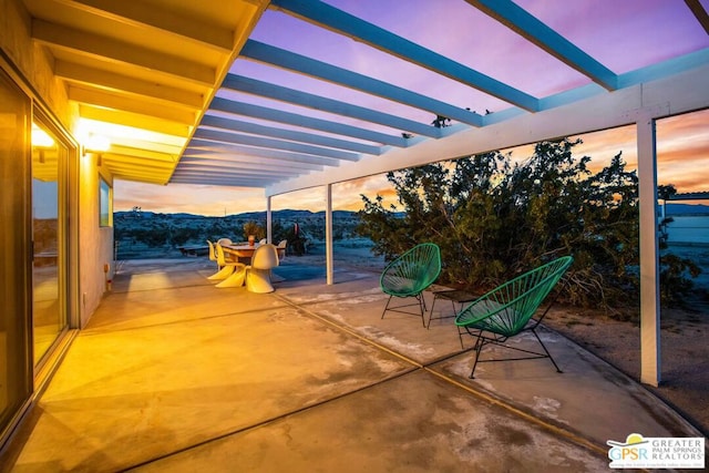 patio terrace at dusk with a mountain view