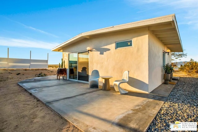 rear view of house with a patio