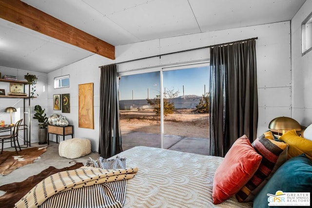 bedroom with concrete floors, access to exterior, and beam ceiling