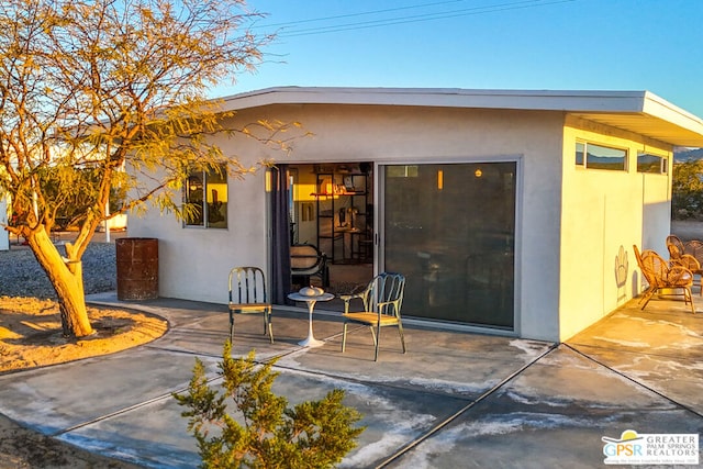 entrance to property with a patio area