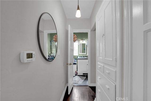 hallway with dark wood-type flooring