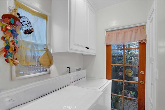 laundry room with cabinets and washer and dryer