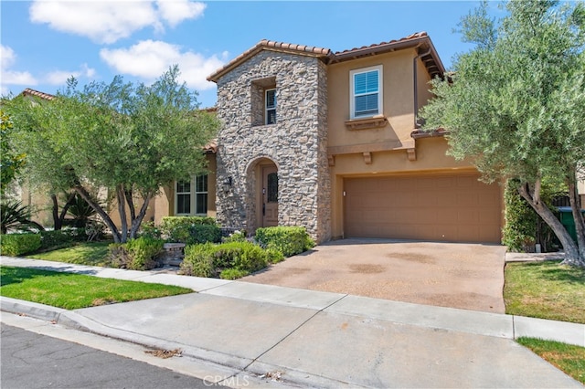 mediterranean / spanish-style home featuring a garage