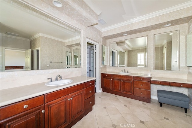 bathroom featuring ornamental molding and vanity