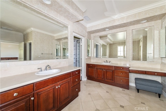 bathroom with crown molding, vanity, and tile patterned floors