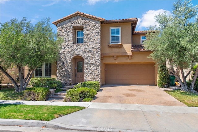 mediterranean / spanish home featuring a garage