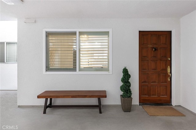 entrance foyer with a textured ceiling