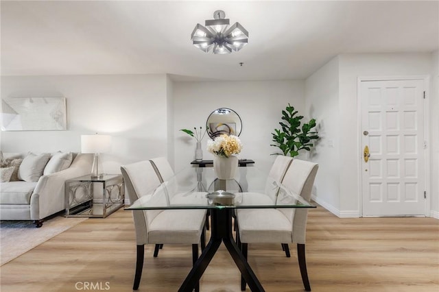 dining area featuring light wood-type flooring