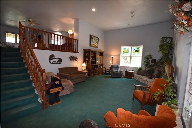 living room featuring ceiling fan and carpet flooring