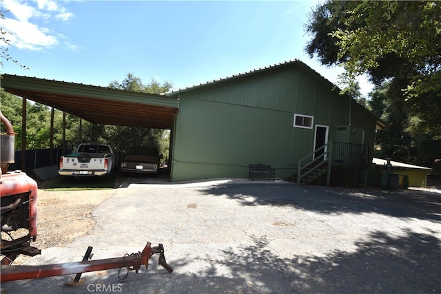 view of home's exterior featuring a carport