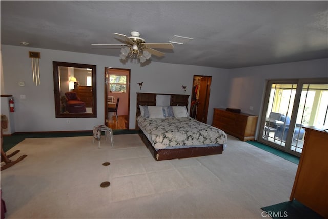 bedroom featuring light carpet, multiple windows, and ceiling fan