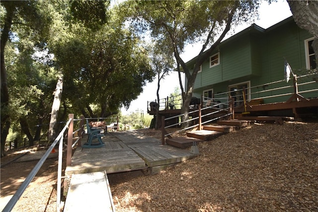 view of yard featuring a wooden deck